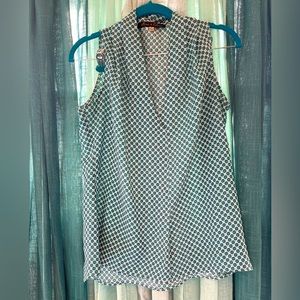 Sleeveless white blouse with tiny mandalas.